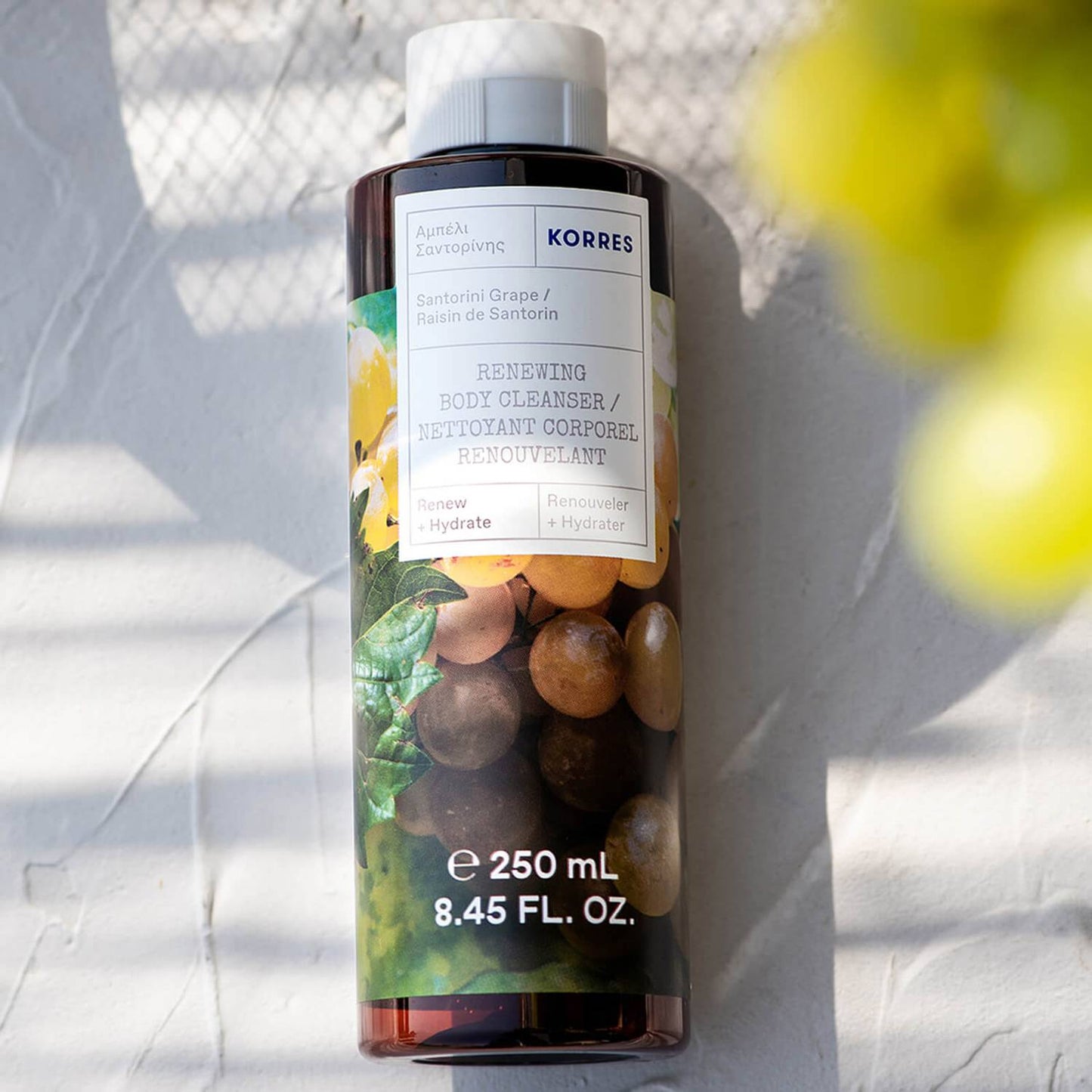 Korres Santorini Grape Renewing Body Cleanser with aloe extract, wheat proteins, and althea extract to help sustain skin's natural moisture levels, delivering a comforting cleanse.