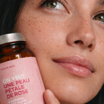 Atelier Nubio A Natural, Rosy Glow, S'il Vous Plait jar held against a model's cheek