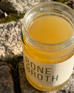 Atelier Nubio Bone Broth Chicken, Thyme & Lemon open jar on stone