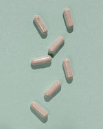 Atelier Nubio Purify My Body, S'il Vous Plait capsules on a sage green background