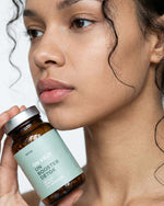 Atelier Nubio Purify My Body, S'il Vous Plait jar held by a model