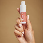 Bouche Bée Emoi clitoral stimulating gel bottle held in hand