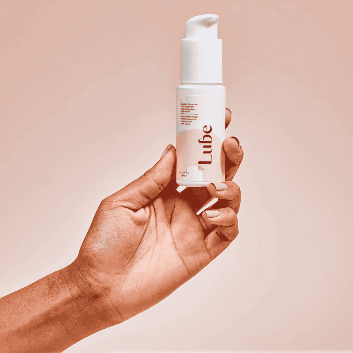 Bouche Bée Lube moisturising lubricant 50ml pump bottle held in hand