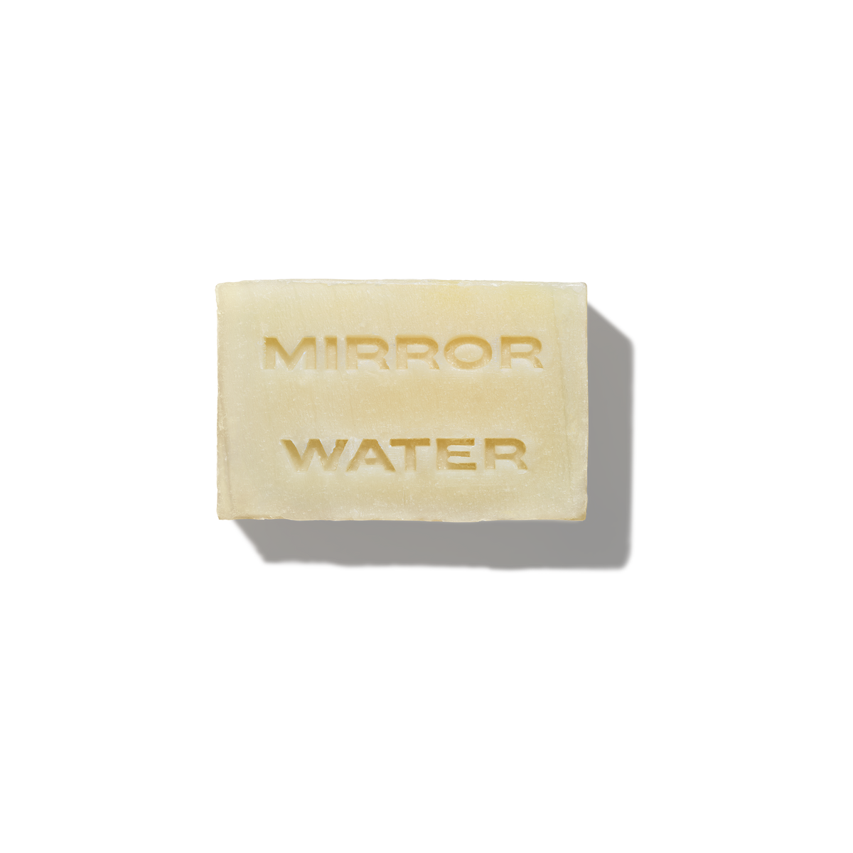 MIRROR WATER Shea Butter Brick solid cleansing bar packshot with embossed logo