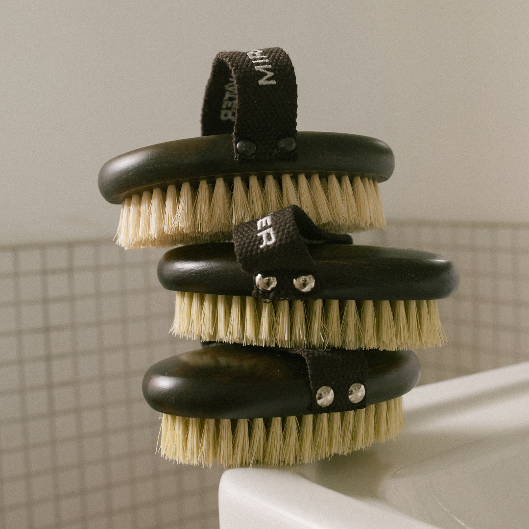 MIRROR WATER Ultra-Soft BUFF Body Dry Brush three brushes stacked bristles-up on a bathroom sink