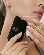 Muihood Bian Stone Face & Body Gua Sha used along the jawline and cheek