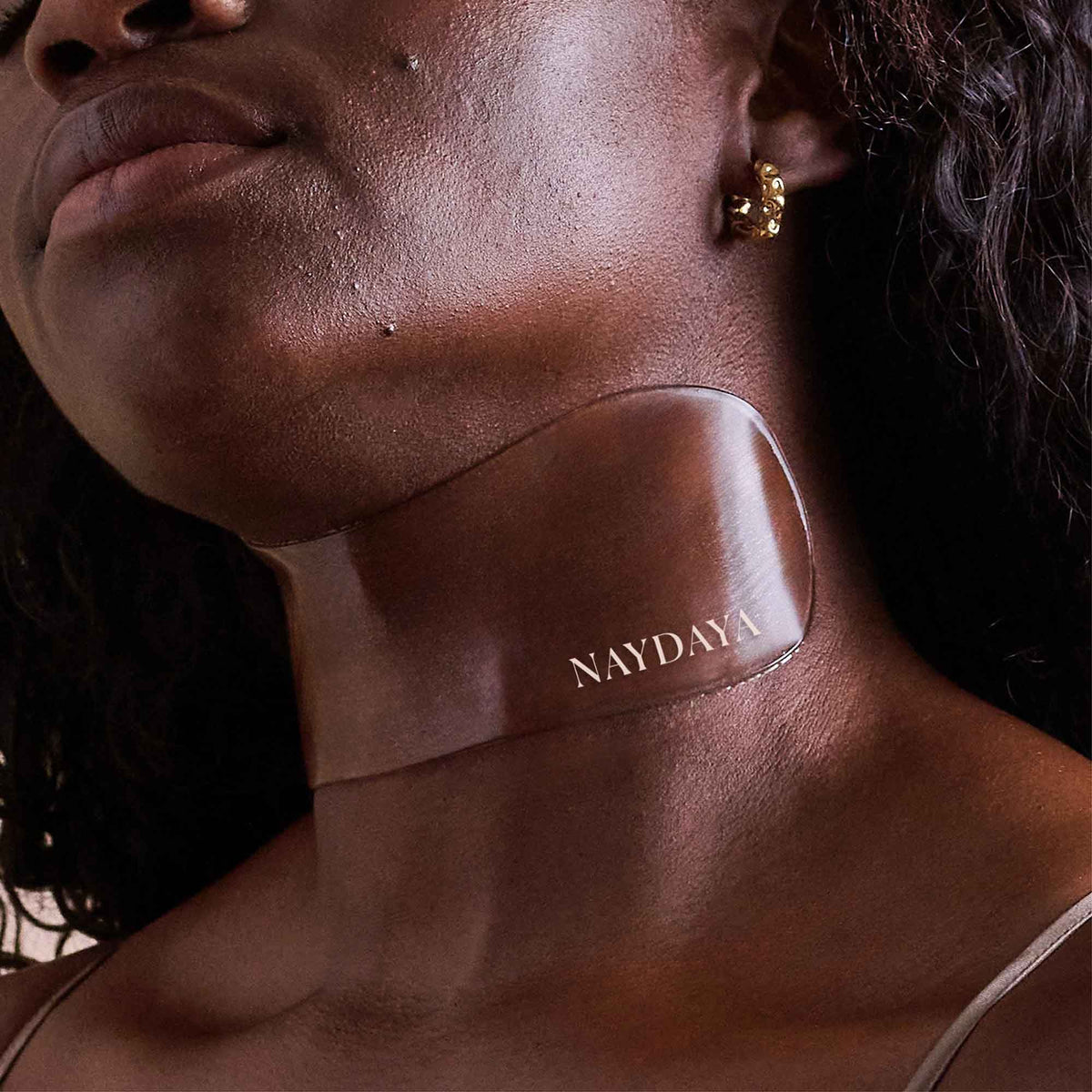 NAYDAYA Neck Wrinkle Shield silicone patch worn on a model's neck