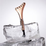 Odacité Cryo-Tech Facial Tool standing in a block of ice