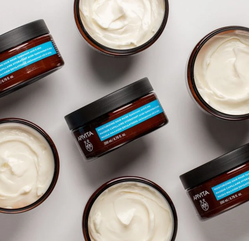 Apivita Hydration & Moisturising Hair Mask with its array of hyaluronic acid, aloe, thyme honey, and oat proteins, the mask replenishes moisture within the hair fibre. 